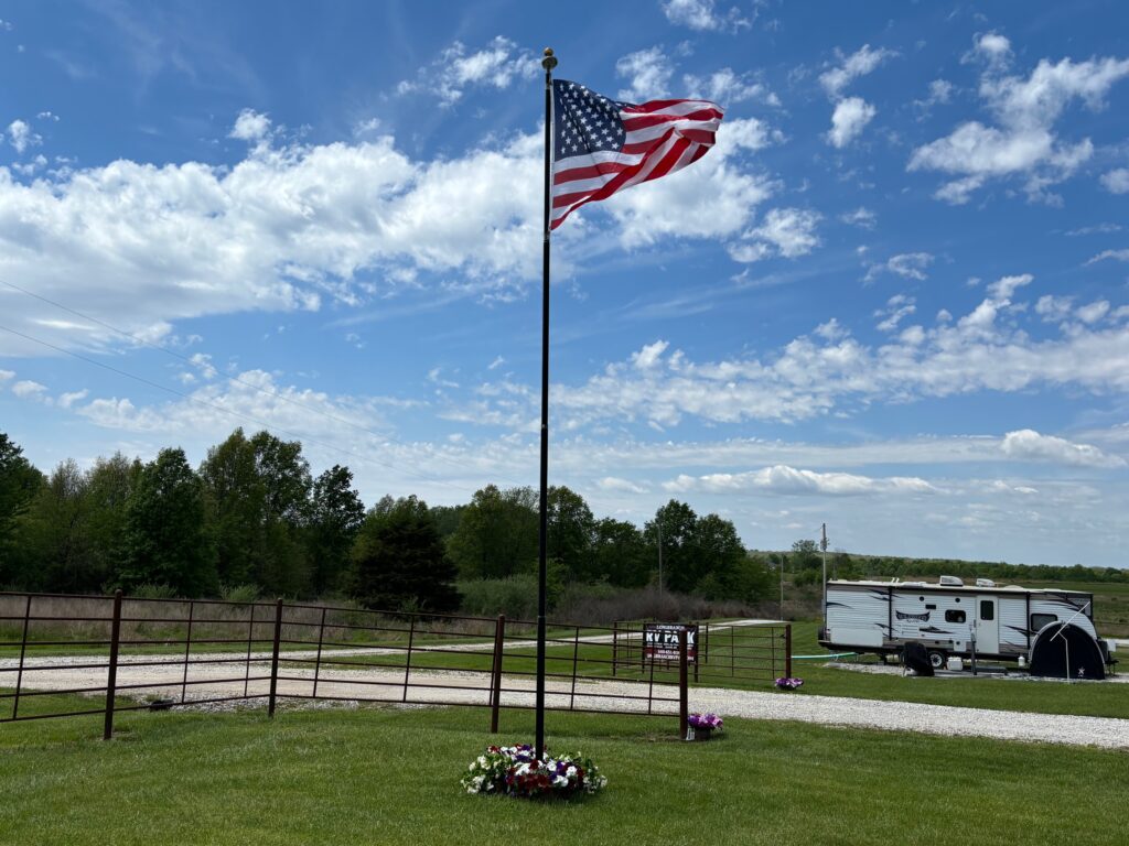 Long Branch RV Park Flag Picture with Flowers