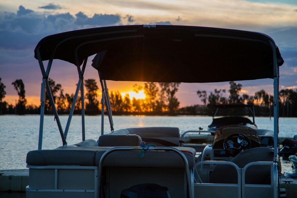 A tranquil sunset scene with a boat on a lake in South Africa.